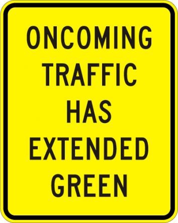 Oncoming Traffic Has Extended Green Sign- W25-1